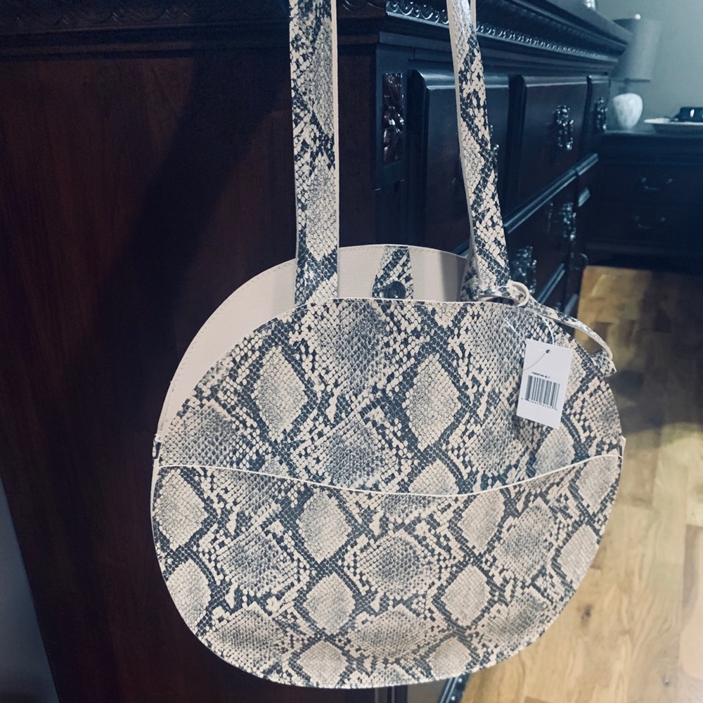 Round snakeskin print bag